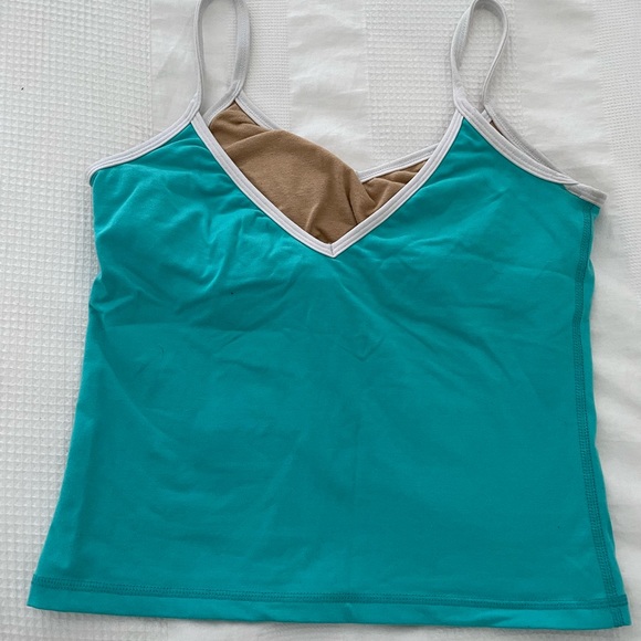 An assortment of Lululemon workout tops - Size 8 - Picture 2 of 8